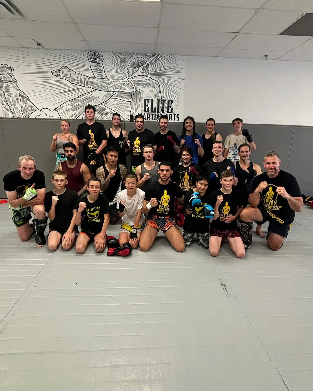 Martial artists celebrate their teamwork in a Muay Thai course in Calgary